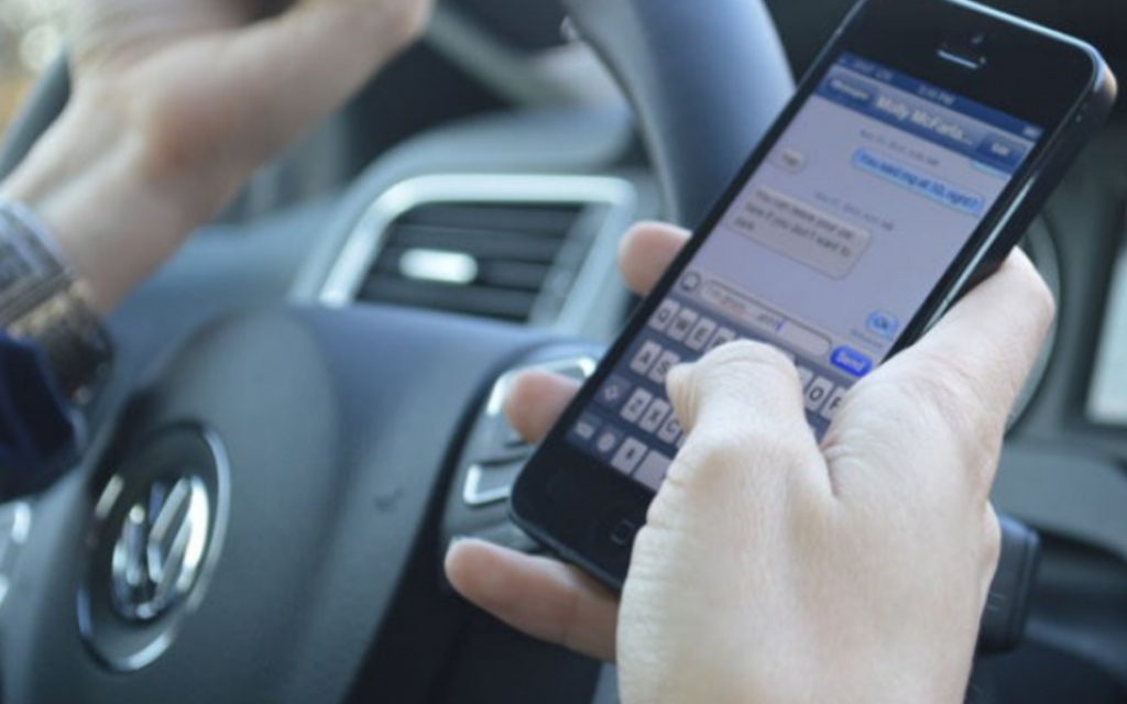 Person Texting While Driving 1080x675 1