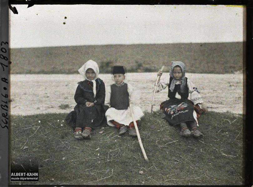 three children seated