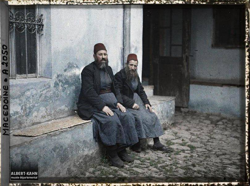 two men sitting down