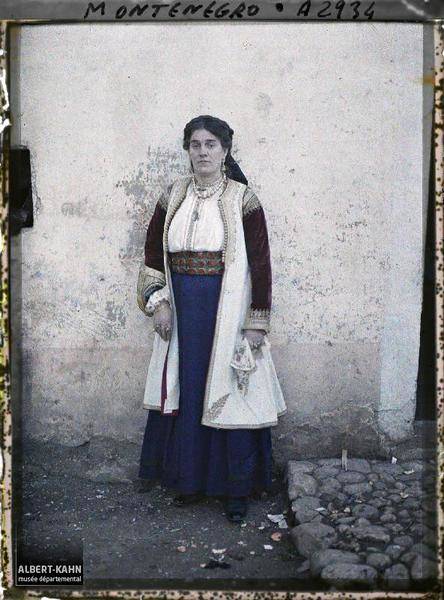 woman posing against wall