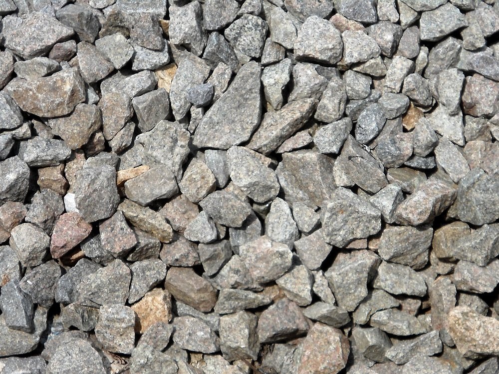 Chipped Stones beside Rail Tracks
