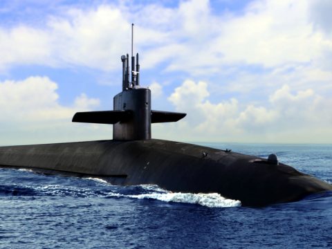 Naval submarine on open blue sea surfacezieusinS